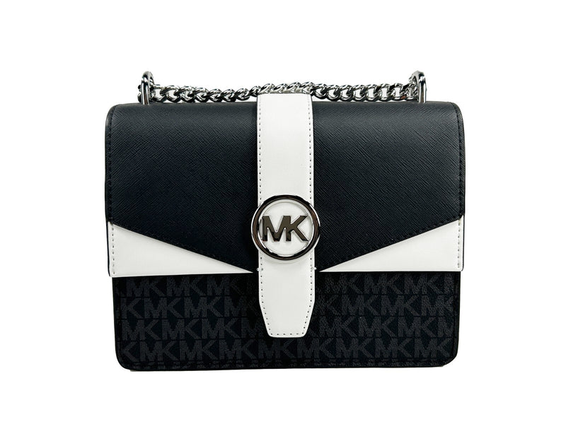 Black and white leather flap crossbody bag with silver chain strap and MK logo clasp