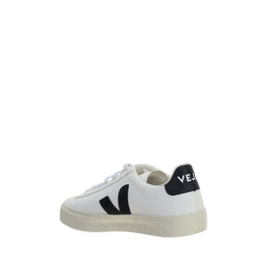 Veja white calf leather low-top sneakers with a black logo patch and heel tab, set on a cream rubber sole.