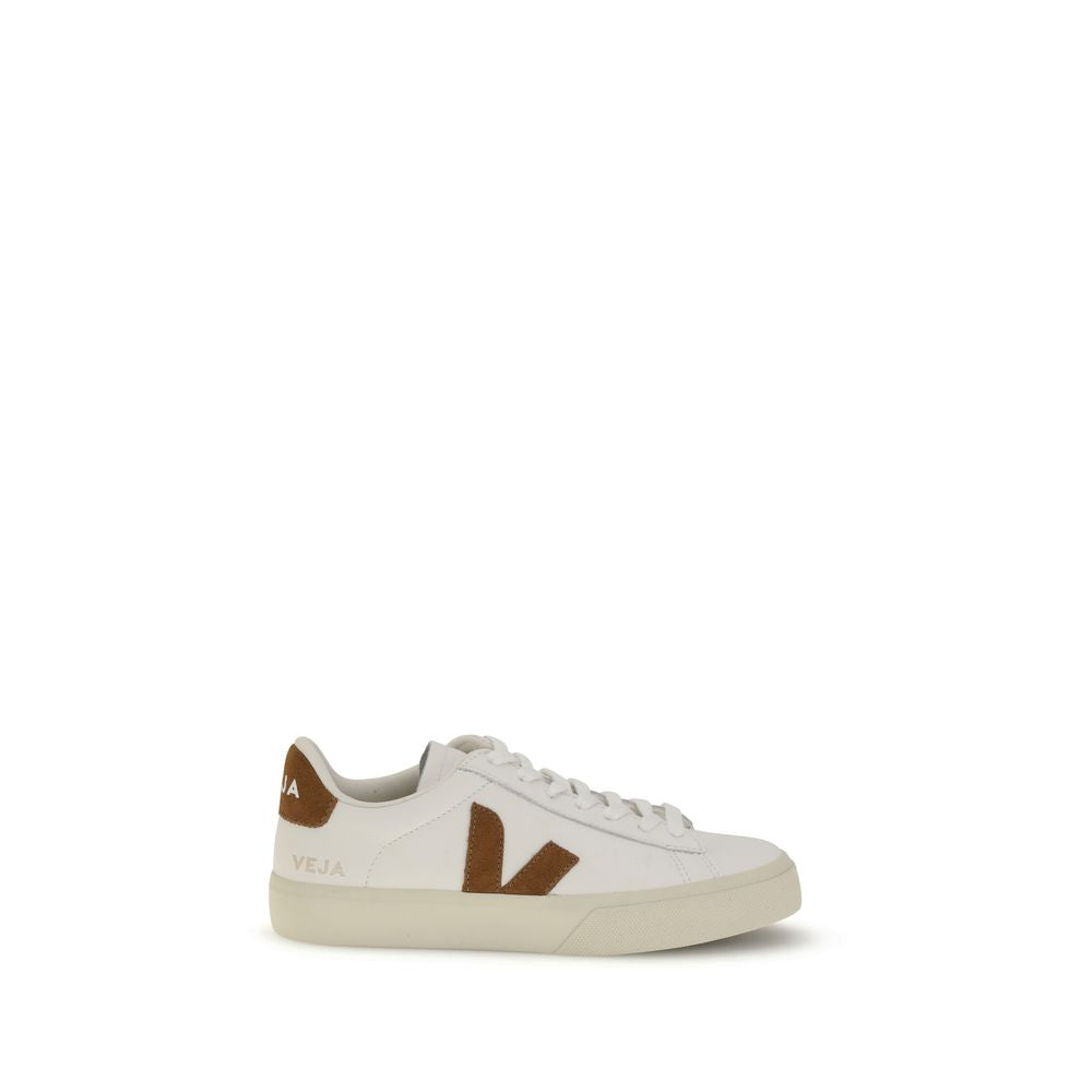 White leather Veja sneakers with brown suede V logo and heel tab, featuring a lace-up low-top style and rubber sole.
