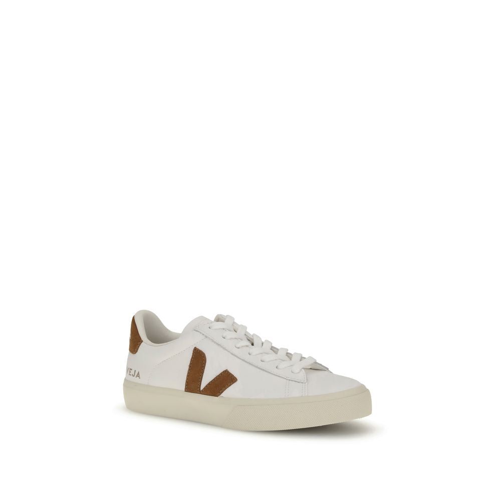 White leather Veja sneakers with a low-top silhouette and brown suede side logo on a cream rubber sole.