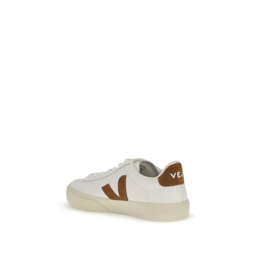 White leather Veja sneakers with a tan suede V logo and heel tab, featuring a minimalist low-top lace-up design.