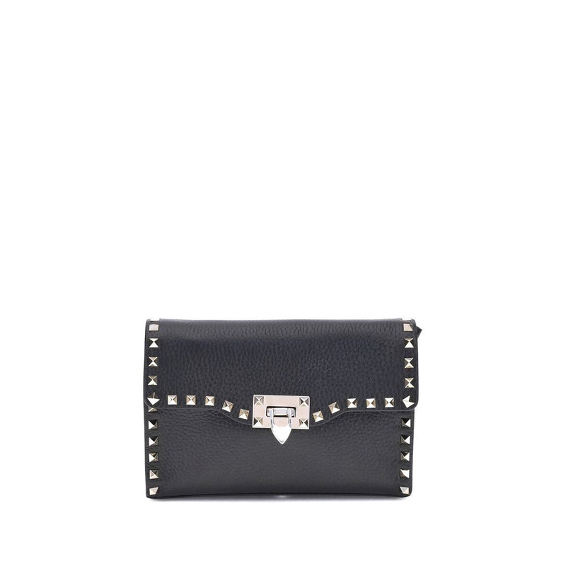 Black leather studded shoulder bag with metallic clasp and hardware