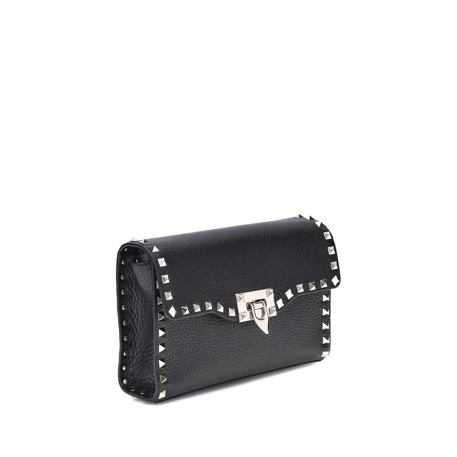 Black leather studded shoulder bag with metallic clasp and hardware