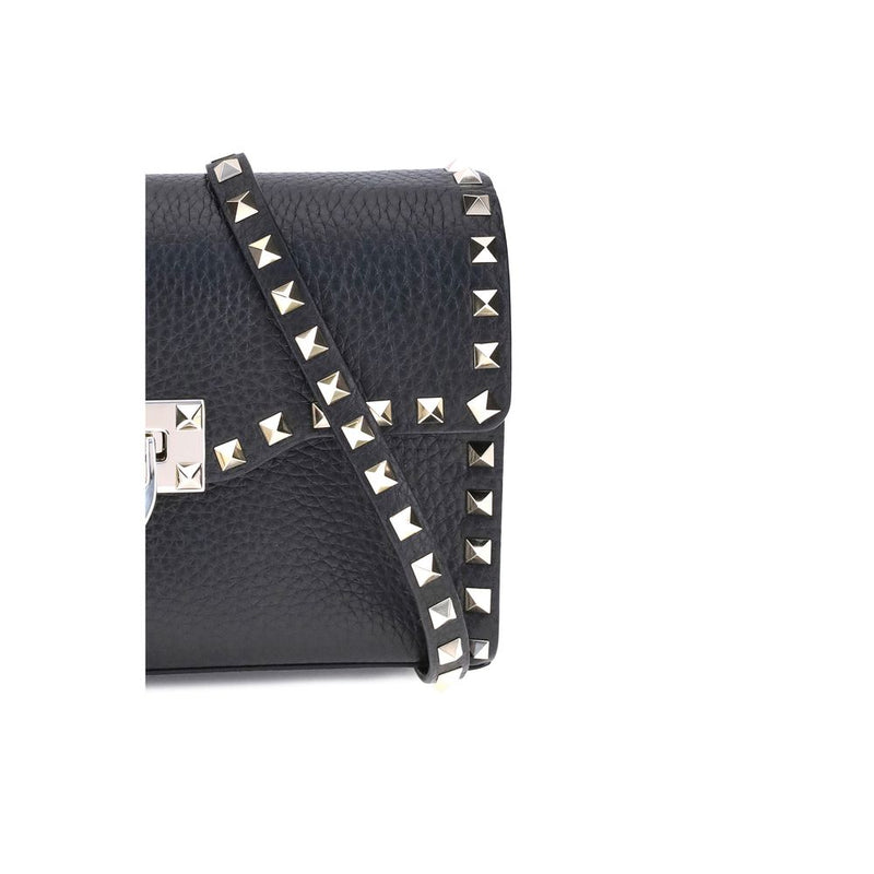 Black pebbled leather shoulder bag with gold pyramid studs