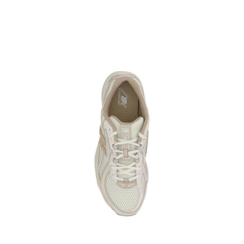 Top-down view of a New Balance cream and beige mesh running sneaker with lace-up closure on a plain white background.