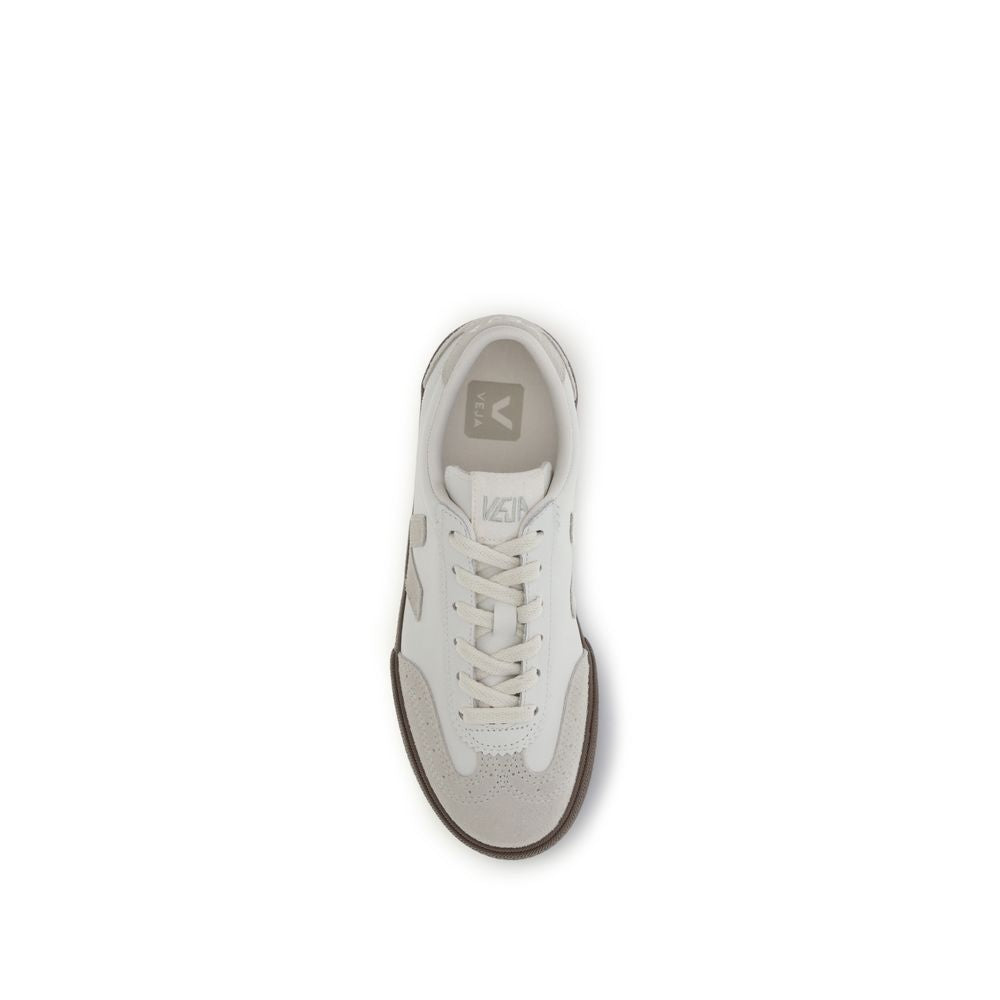 Top-down view of a Veja sneaker in white leather and light gray suede with a dark brown rubber sole.