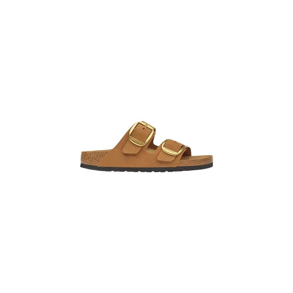 Tan suede Birkenstock sandal with two wide straps, oversized gold buckles, and a contoured cork-latex footbed.