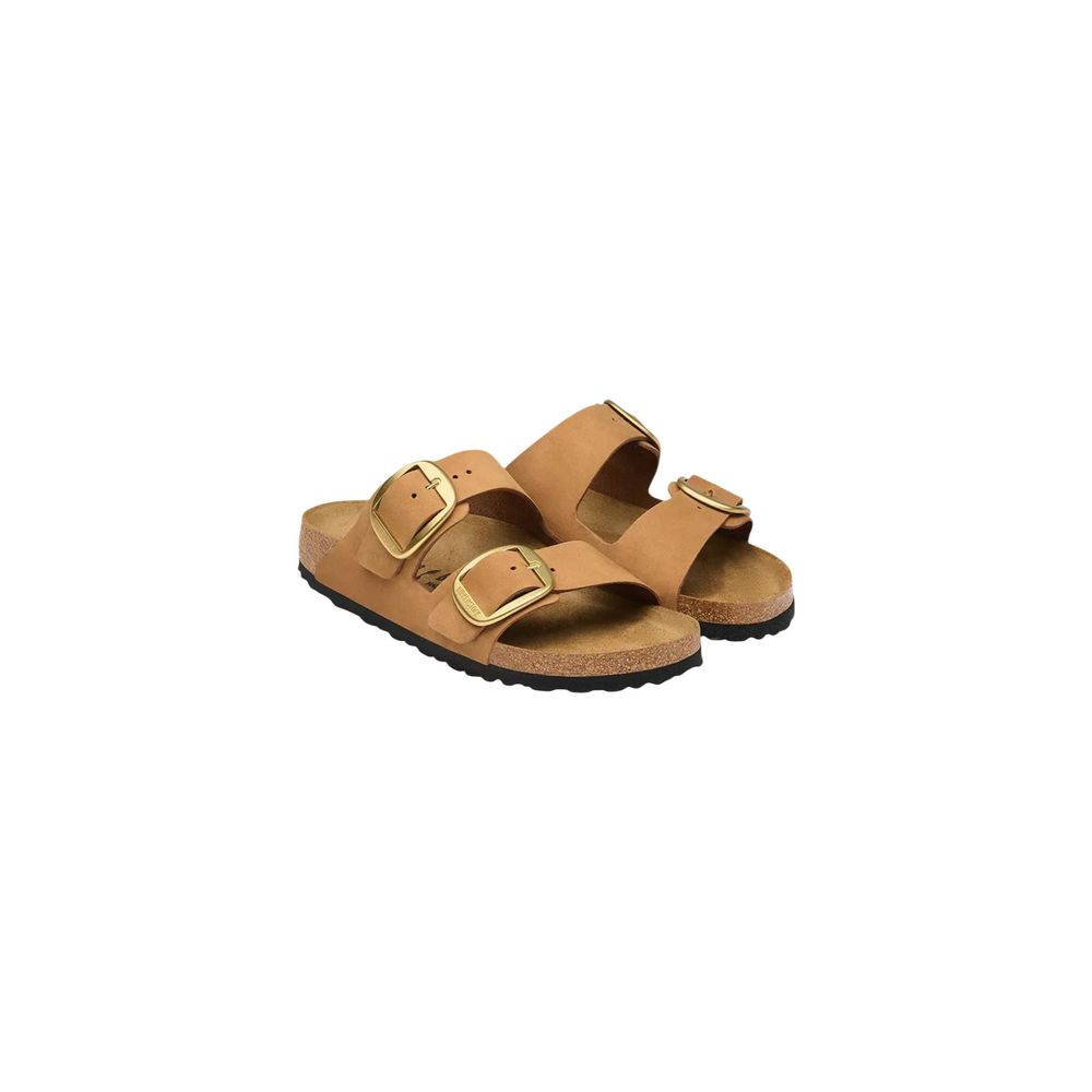 Tan nubuck leather two-strap sandals with large gold buckles and a contoured cork footbed on a black rubber sole.