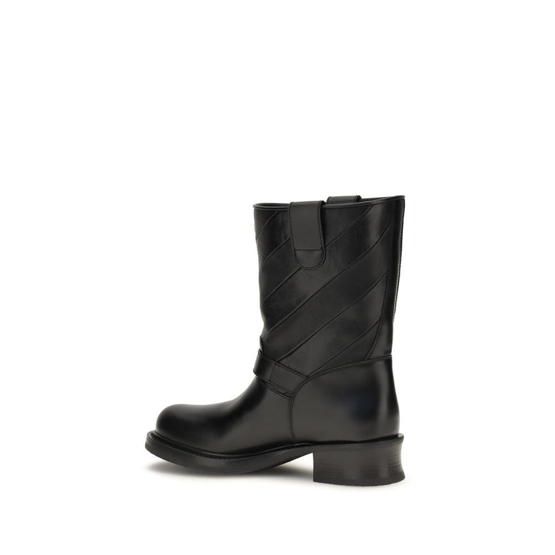 Black calf leather ankle boot with diagonal stitching and a low block heel