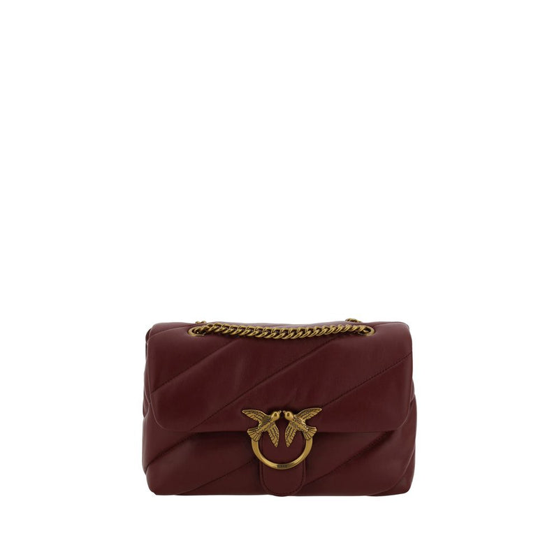 Burgundy quilted leather shoulder bag with gold chain strap and interlocking bird clasp