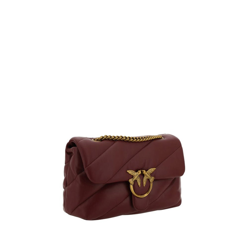 Burgundy quilted leather shoulder bag with a gold chain strap and metal bird clasp