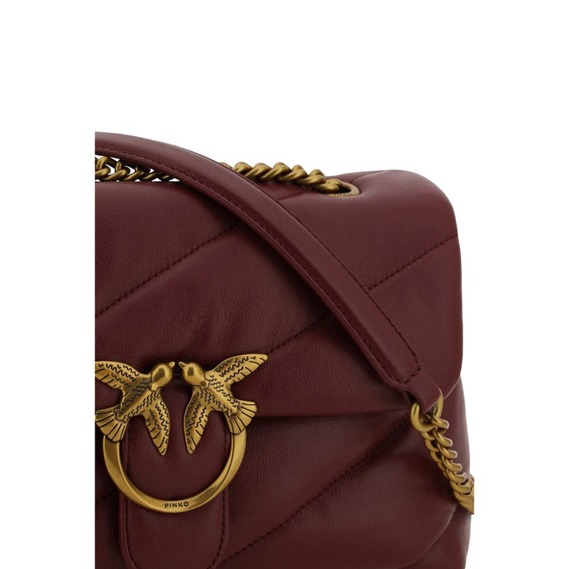 Burgundy quilted leather shoulder bag with gold-tone hardware and chain strap