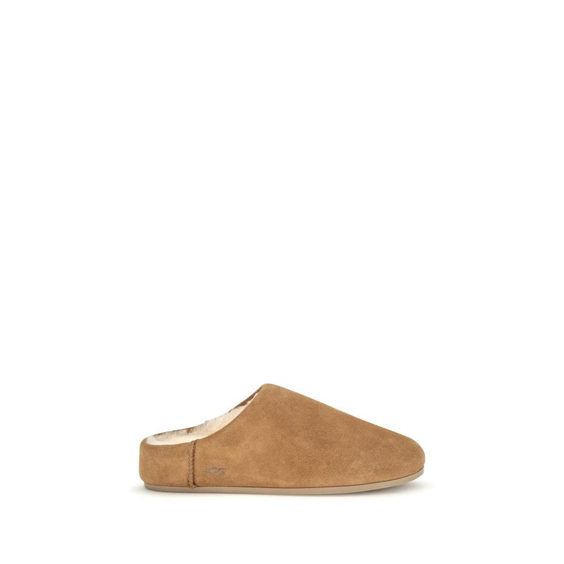 Beige suede mule with cream shearling lining and flat sole