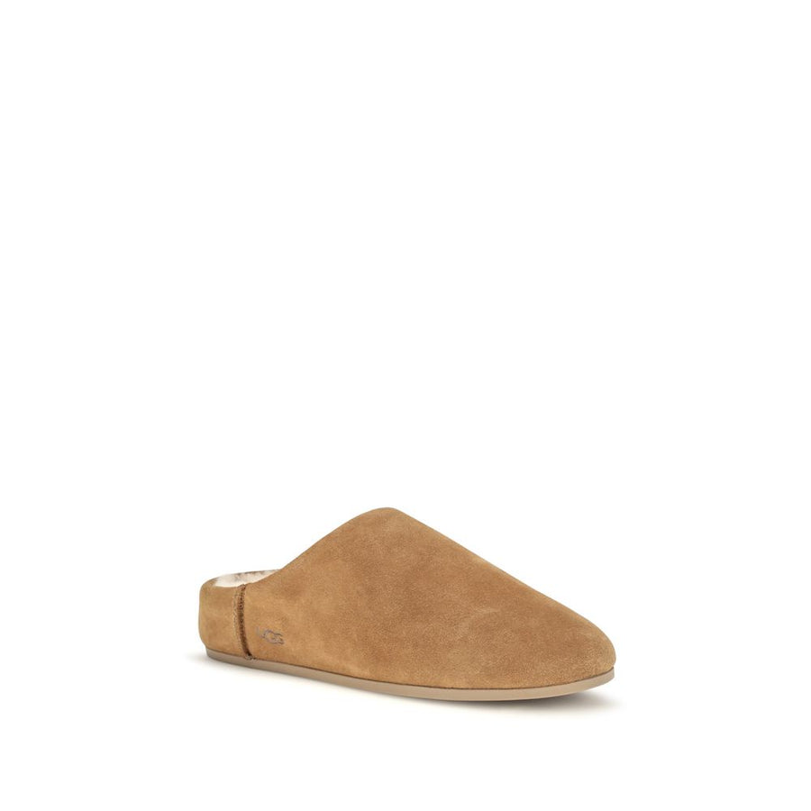 Beige suede mule with cream shearling lining and flat sole