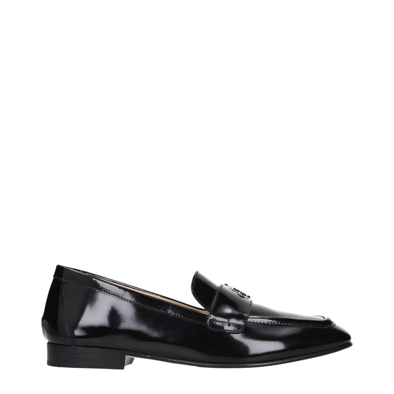 Black patent leather slip-on loafer with a low heel