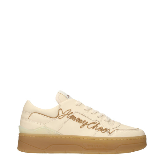 Beige leather low top sneaker with brown embroidered logo and gum sole