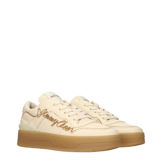 Beige leather low top sneakers with thick rubber soles and embroidered logo lettering