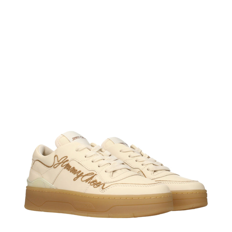 Beige leather low top sneakers with thick rubber soles and embroidered logo lettering