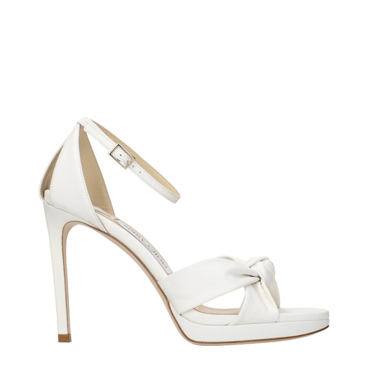 White leather high-heeled platform sandal with knotted toe strap and ankle buckle closure