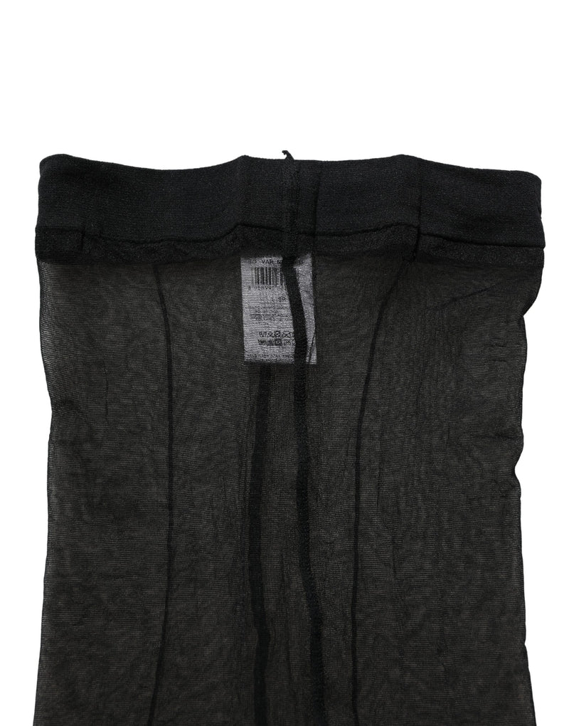 Sheer black nylon pantyhose with a wide elastic waistband and reinforced seams