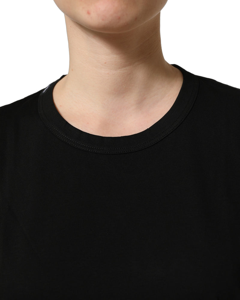 Black cotton crew neck short sleeve t-shirt worn on a person