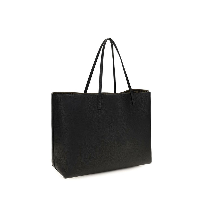 Black leather shoulder bag with slim straps and a patterned interior lining