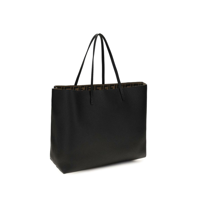 Black leather tote bag with thin dual handles and a patterned inner lining