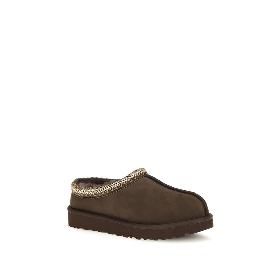 Brown suede slip-on mule with plush lining and patterned trim