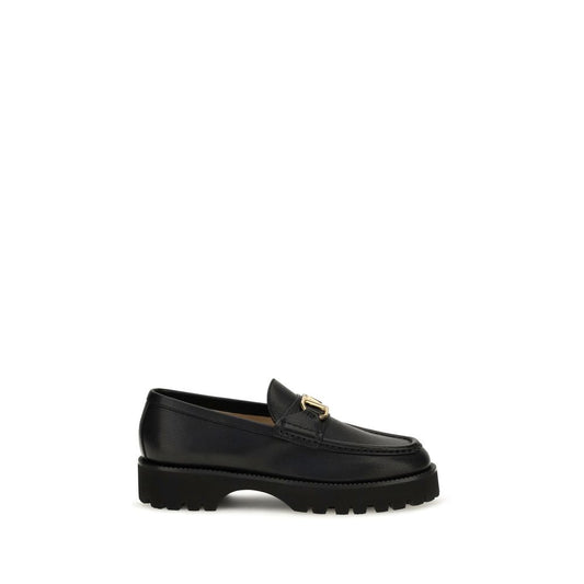 Black goatskin platform loafer with a lug sole and gold hardware