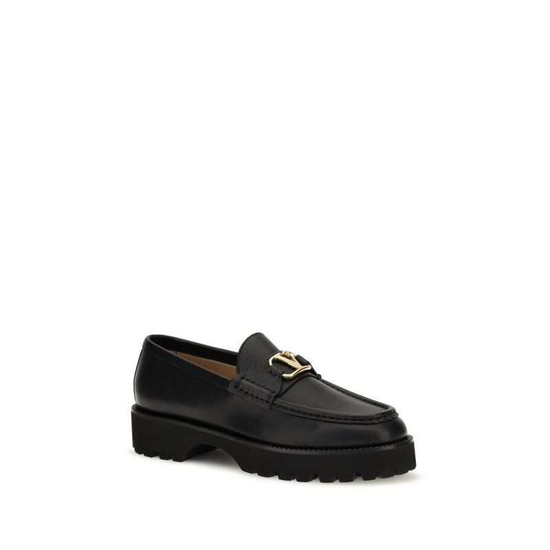Black goatskin leather platform loafer with a thick lug sole and gold V logo hardware
