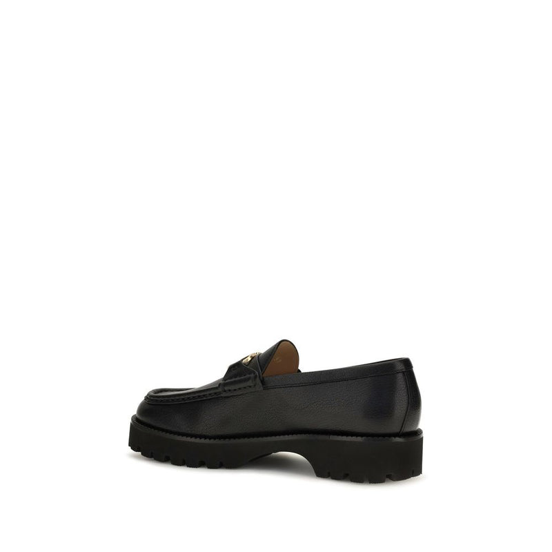 Black goatskin leather platform loafer with lug sole viewed from the side