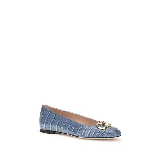 Blue embossed leather ballet flat with a gold logo on the toe