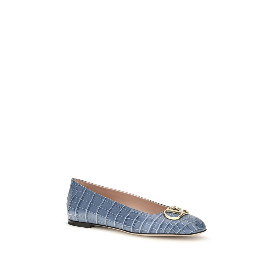 Blue embossed leather ballet flats with a gold-tone logo buckle