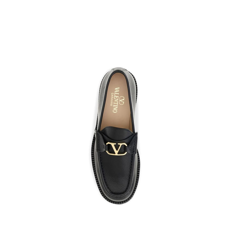 Black goatskin leather platform loafer with a gold VLogo hardware on the strap