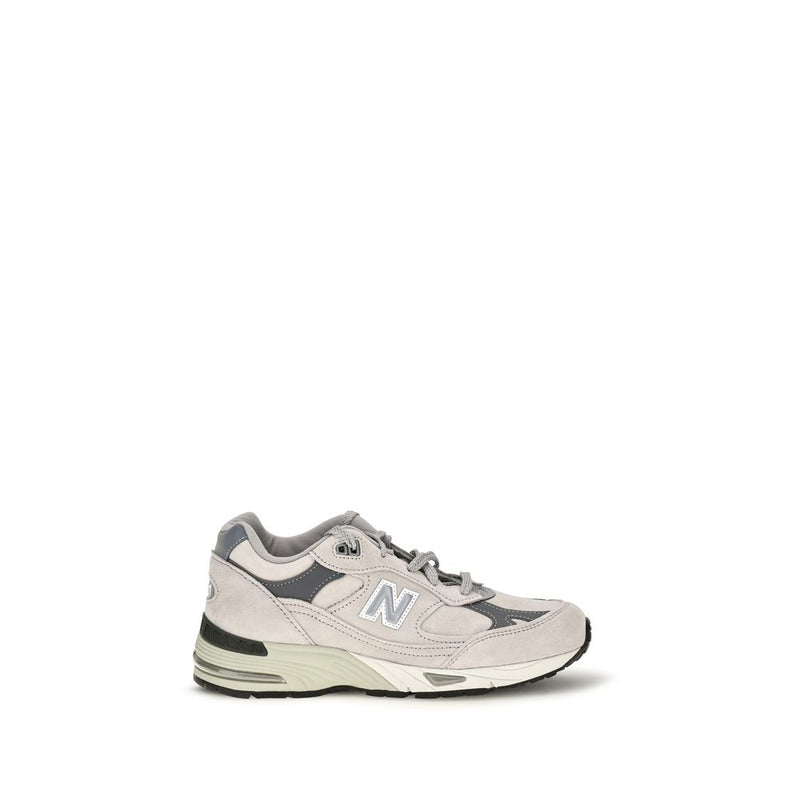 Gray suede leather athletic sneaker with white N logo and chunky sole