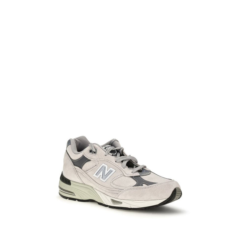 Gray suede athletic sneaker with white N logo and chunky sole