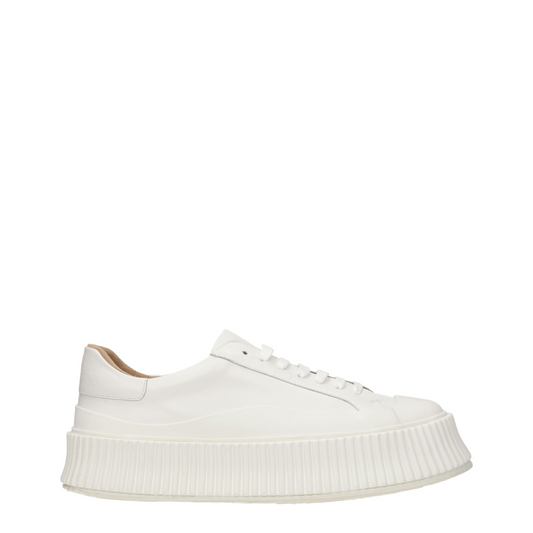 White leather platform sneaker with a thick ridged rubber sole and white laces