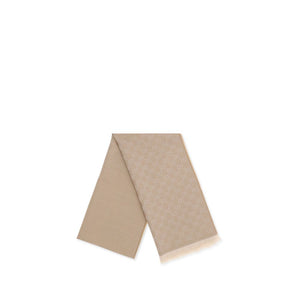 Beige wool foulard with allover GG monogram pattern and fringed ends.