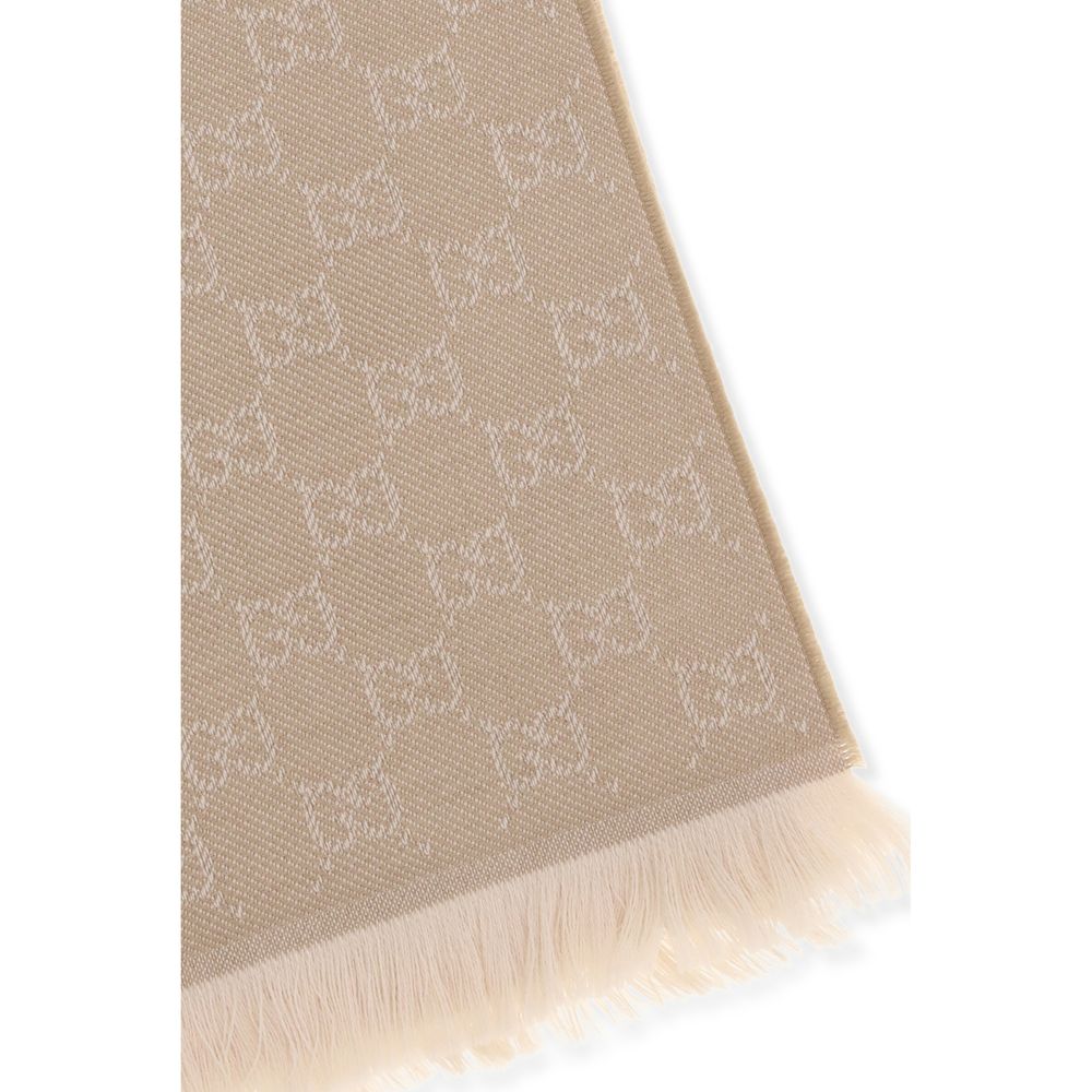 Beige wool scarf with allover white GG monogram pattern and fringed hem.