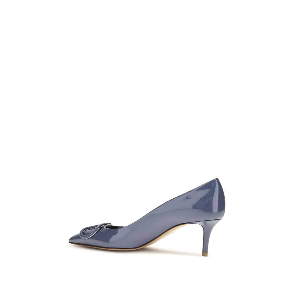 Valentino Garavani blue patent leather pointed-toe pump with a curved kitten heel and bow detail.