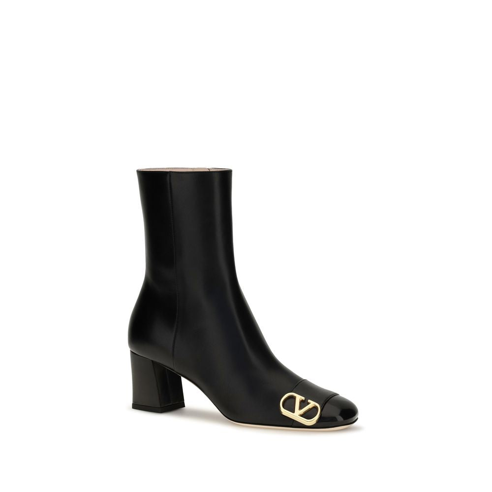 Valentino Garavani black calf leather ankle boot with block heel and gold-tone VLogo detail on the toe.