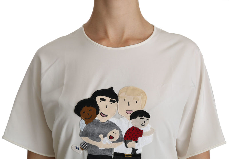 White short sleeve silk blouse with a family patch on the front