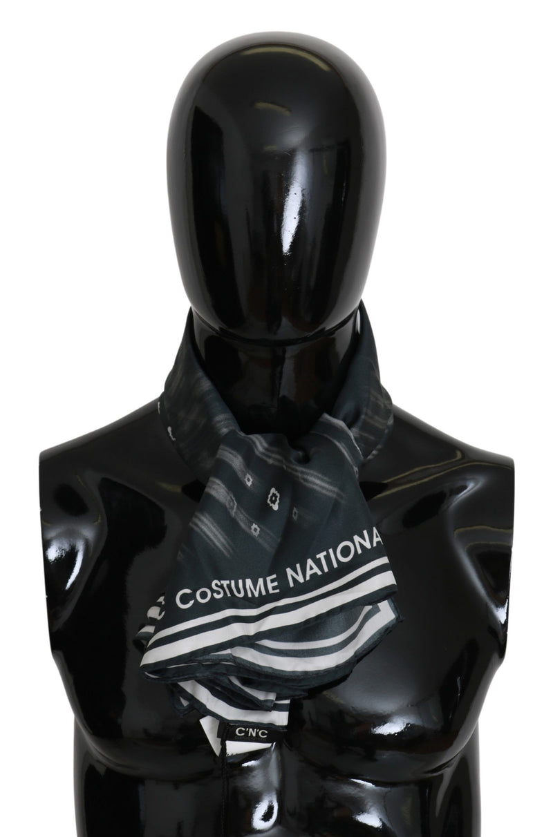 Blue silk foulard scarf by Costume National with white brand lettering and striped pattern on a black mannequin