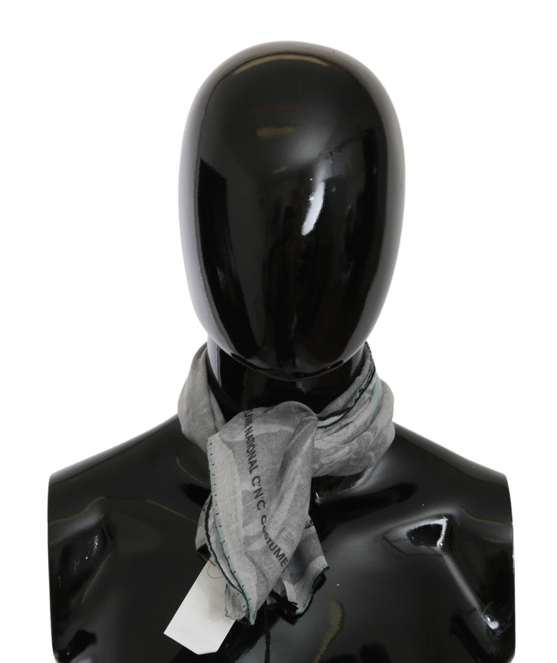 Gray silk scarf wrapped neatly around a black mannequin neck
