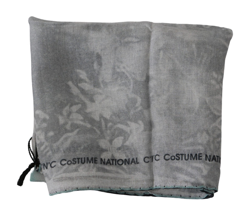Costume National gray silk scarf folded with a subtle floral print and black text logo along the border