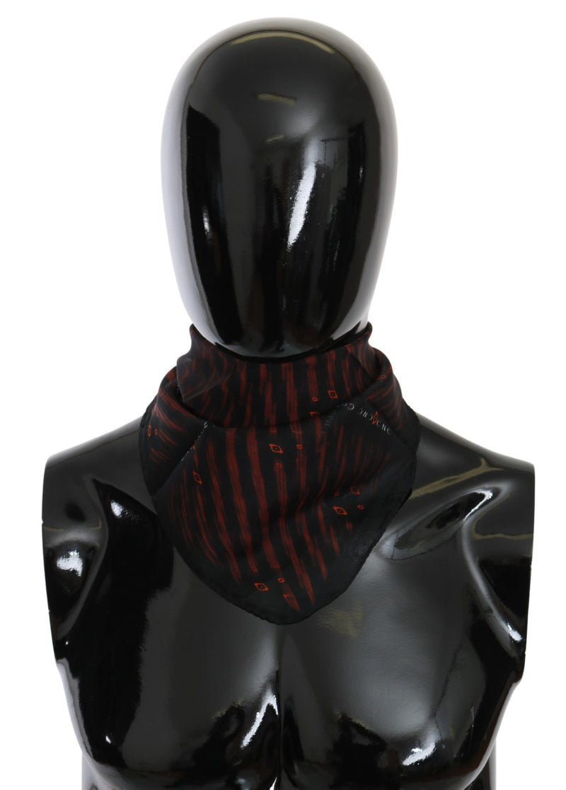 Costume National black and orange silk patterned neck scarf on a mannequin