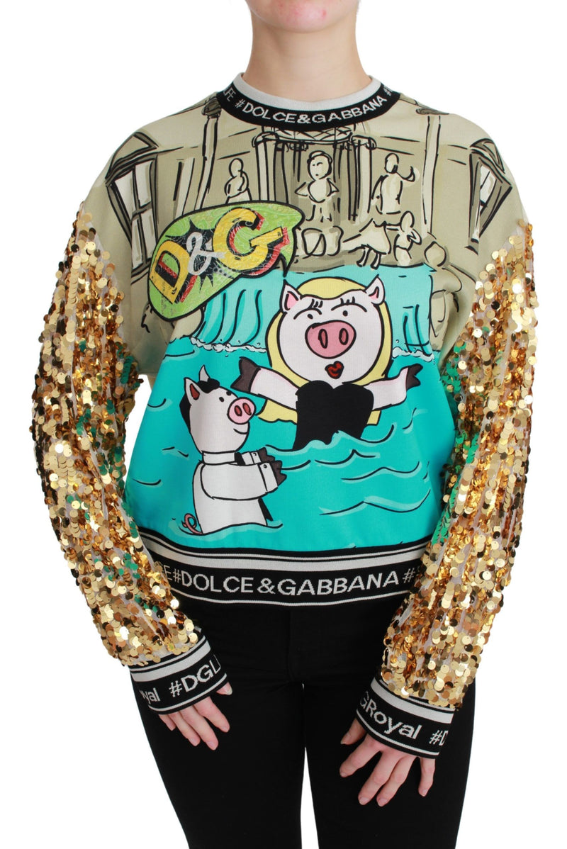 Beige and turquoise crewneck sweater featuring a pig graphic and long sleeves covered in gold sequins