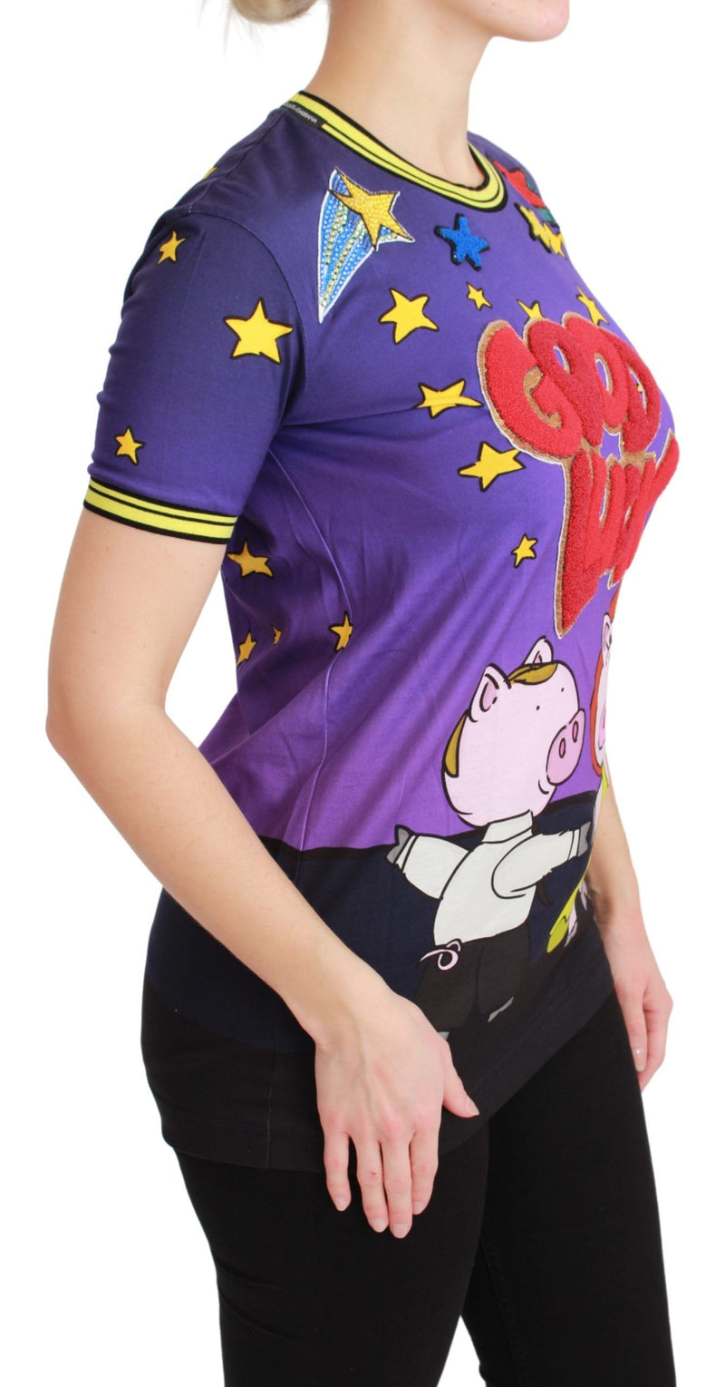 Purple cotton t-shirt with short sleeves, yellow stars, red text, and pig graphics