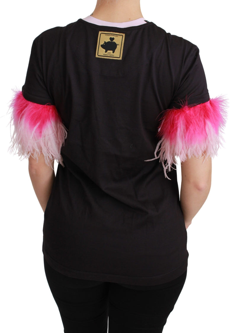 Black cotton t-shirt with short sleeves trimmed in bright pink feathers and a gold Year of the Pig patch on the back