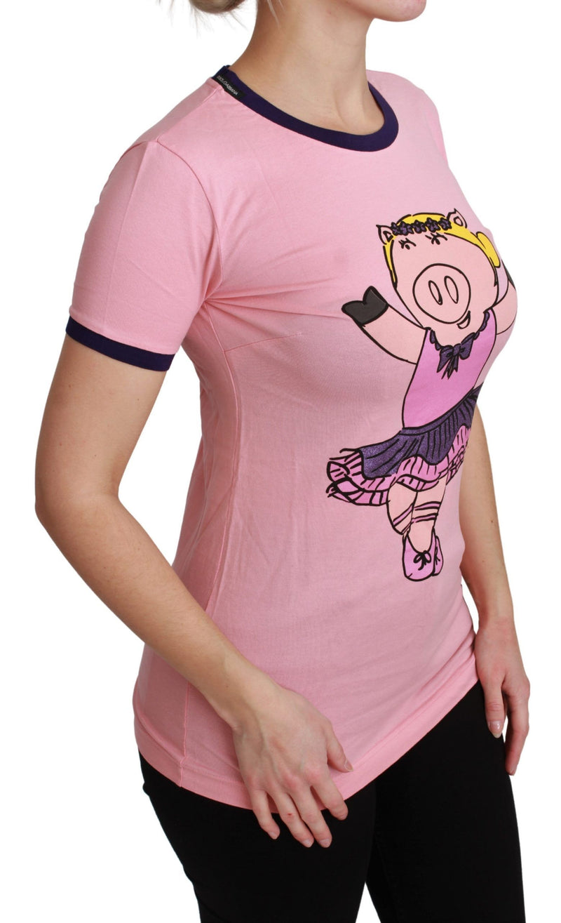 Pink cotton t-shirt with short sleeves, dark blue trim, and a graphic of a pig ballerina on the front